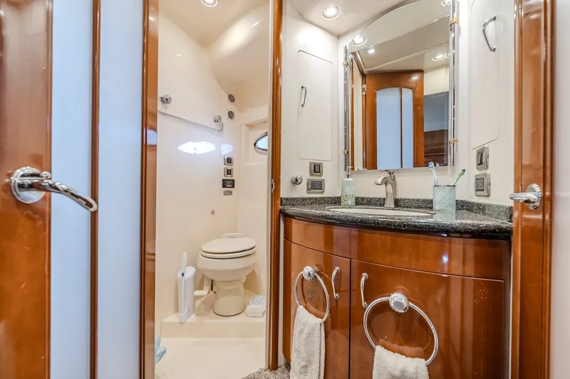Slide: The Image of Luxurious bathroom in 2006 Carver 56 Voyager yacht with elegant wood cabinetry. - 60