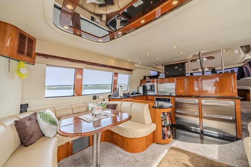Slide: The Image of Luxurious interior of a 2006 Carver 56 Voyager yacht with elegant wood finishes and modern amenities. - 32