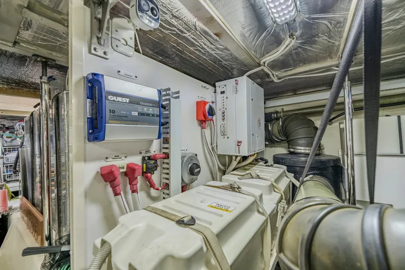 Slide: The Image of Engine room of 2006 Carver 56 Voyager yacht with electrical systems and components. - 74