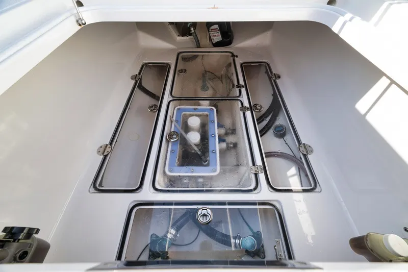 Slide: The Image of Engine compartment of a 2020 Bahama 41 boat, showcasing clean, organized layout. - 36