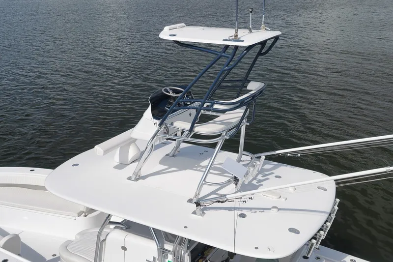 Slide: The Image of 2020 Bahama 41 boat with elevated helm station on calm water. - 28