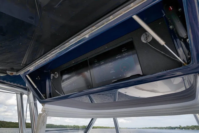 Slide: The Image of 2020 Bahama 41 boat dashboard with Garmin navigation display. - 63