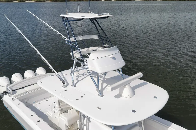 Slide: The Image of 2020 Bahama 41 boat with elevated helm, on calm water. - 29