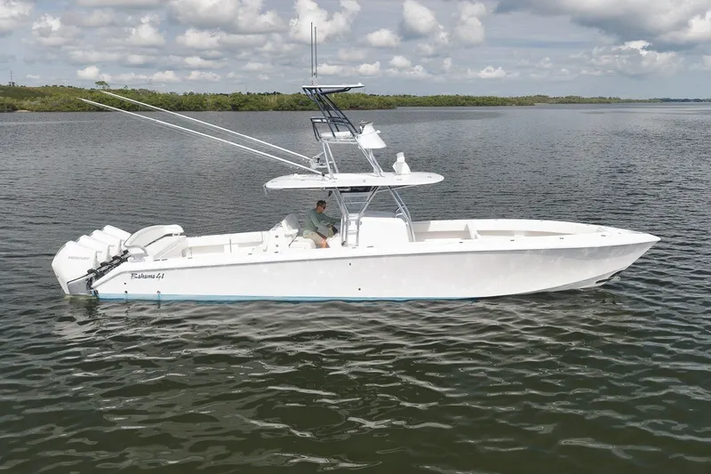 Slide: The Image of 2020 Bahama 41 boat on calm water under cloudy sky. - 1