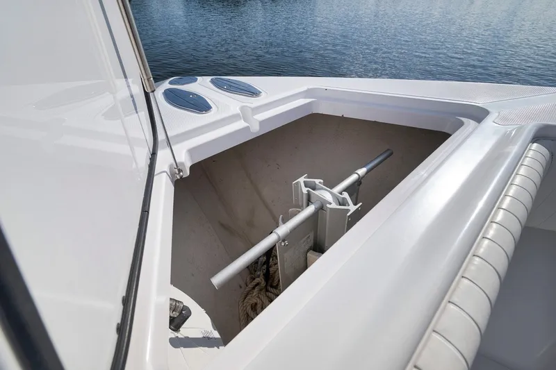 Slide: The Image of Anchor storage compartment on a 2020 Bahama 41 boat, open hatch view. - 51
