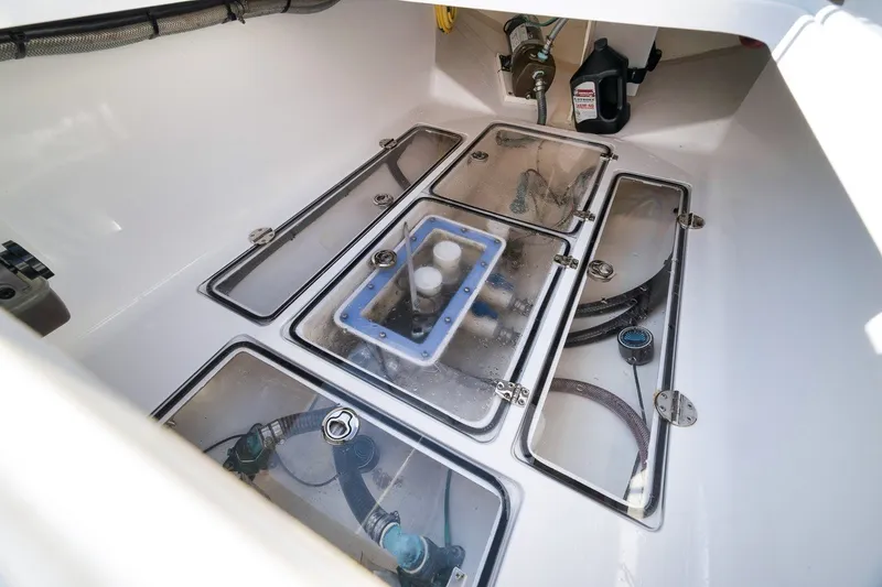 Slide: The Image of Engine compartment of a 2020 Bahama 41 boat, showcasing mechanical components and wiring. - 34