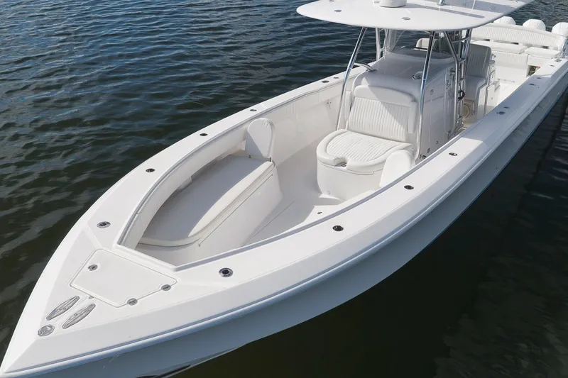 Slide: The Image of 2020 Bahama 41 boat with sleek white design on calm water. - 27