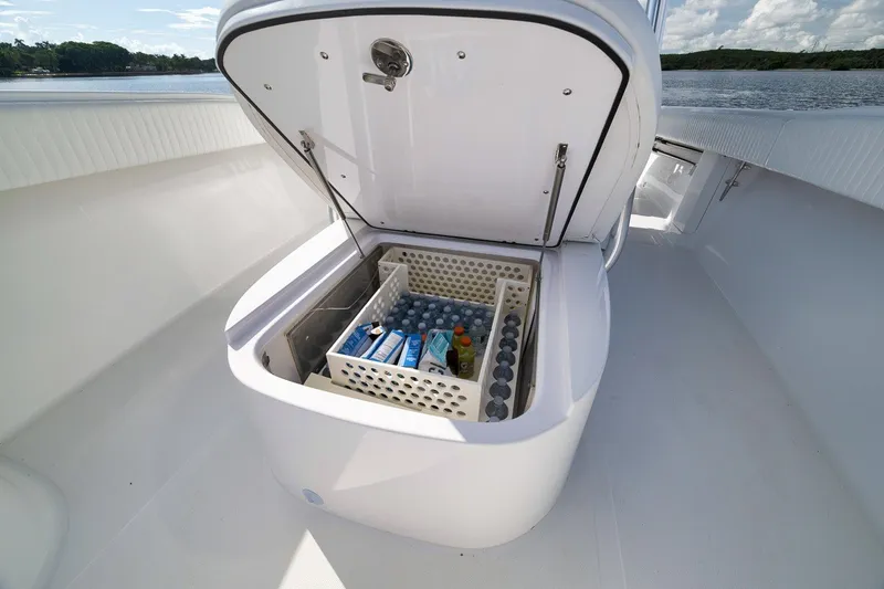 Slide: The Image of Open cooler on 2020 Bahama 41 boat deck, stocked with drinks and snacks. - 53