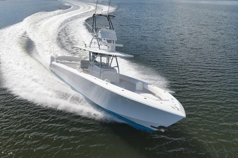 Slide: The Image of 2020 Bahama 41 boat cruising swiftly on open water, leaving a wake trail. - 19