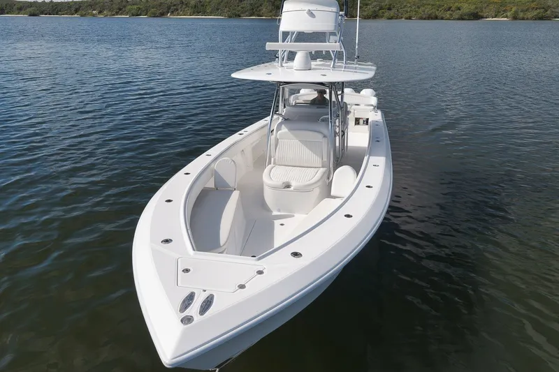 Slide: The Image of 2020 Bahama 41 boat on calm water, showcasing sleek design and spacious deck. - 26