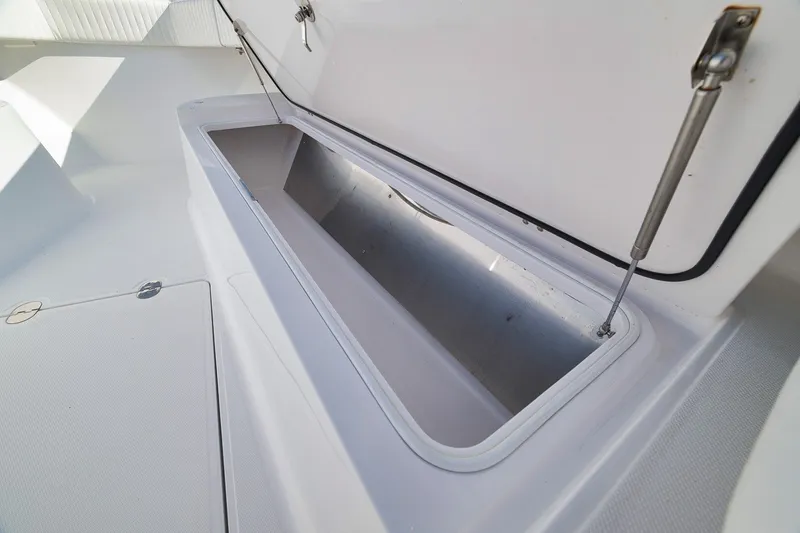 Slide: The Image of Open storage compartment on 2020 Bahama 41 boat deck. - 49