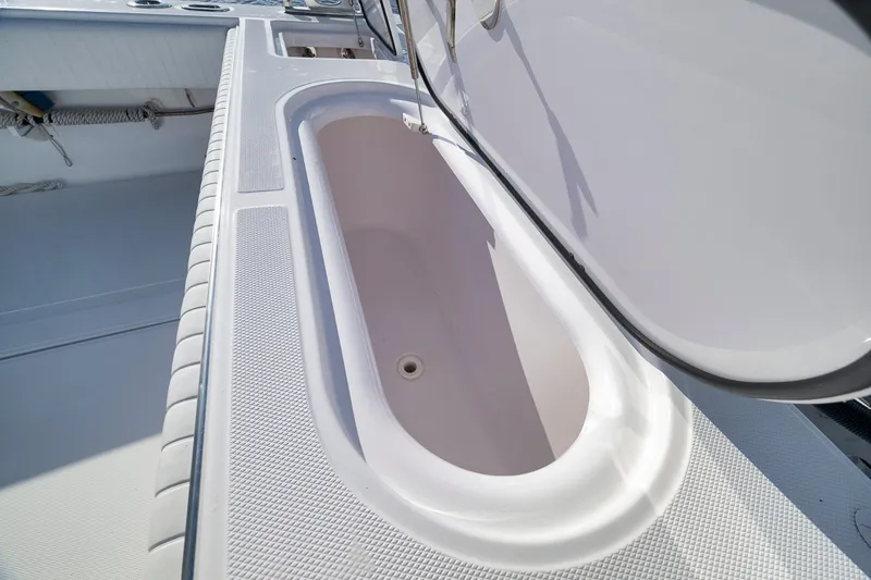 Slide: The Image of Open storage compartment on a 2020 Bahama 41 boat deck. - 43