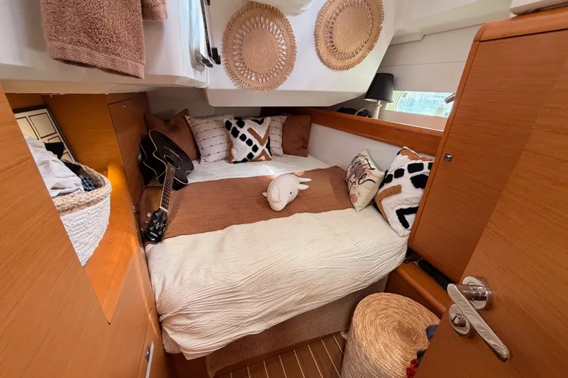Slide: The Image of Cozy cabin interior of 2015 Jeanneau Sun Odyssey 469 with stylish decor and guitar. - 51