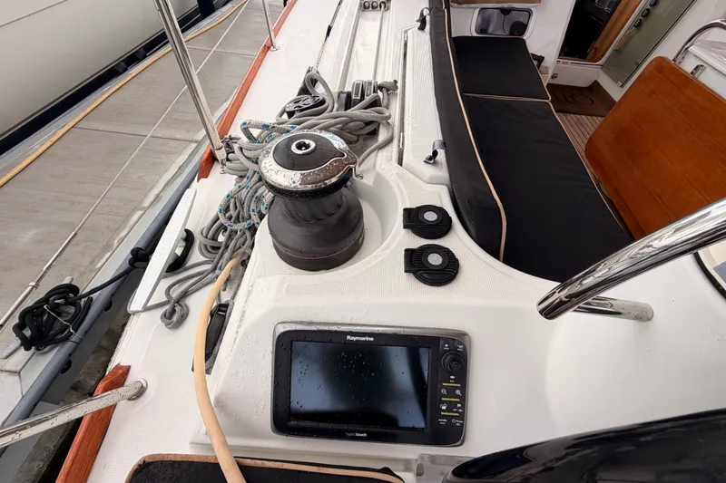 Slide: The Image of Cockpit of 2015 Jeanneau Sun Odyssey 469 sailboat with winch and navigation display. - 34