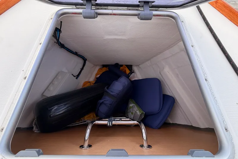 Slide: The Image of Storage compartment of 2015 Jeanneau Sun Odyssey 469 sailboat with cushions and equipment. - 14