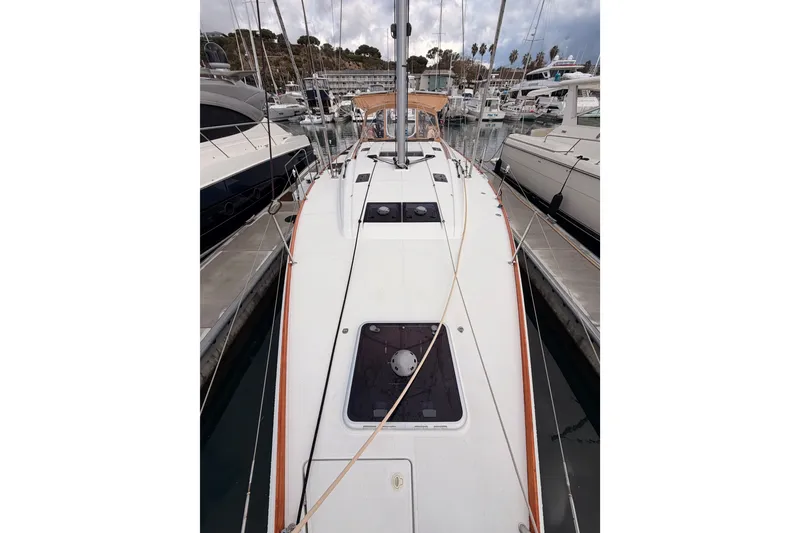 Slide: The Image of 2015 Jeanneau Sun Odyssey 469 sailboat docked at marina, view of deck and rigging. - 17