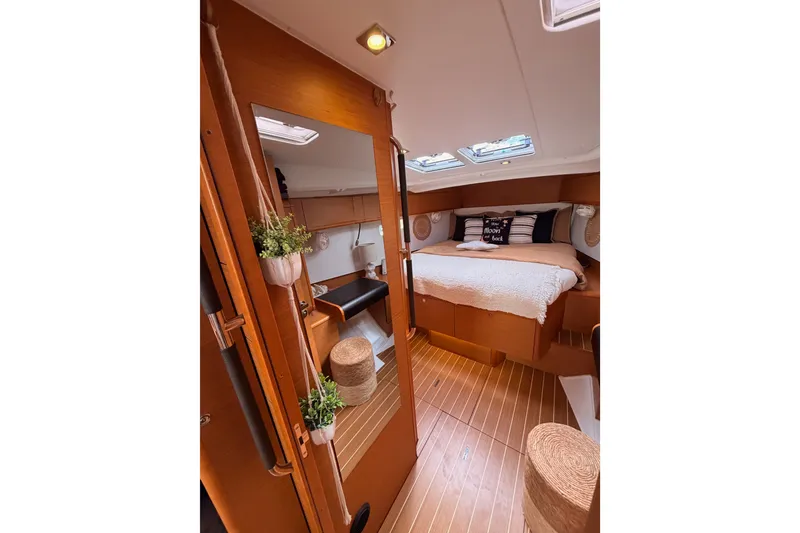 Slide: The Image of Cozy interior of 2015 Jeanneau Sun Odyssey 469 sailboat with wooden finishes and skylights. - 59