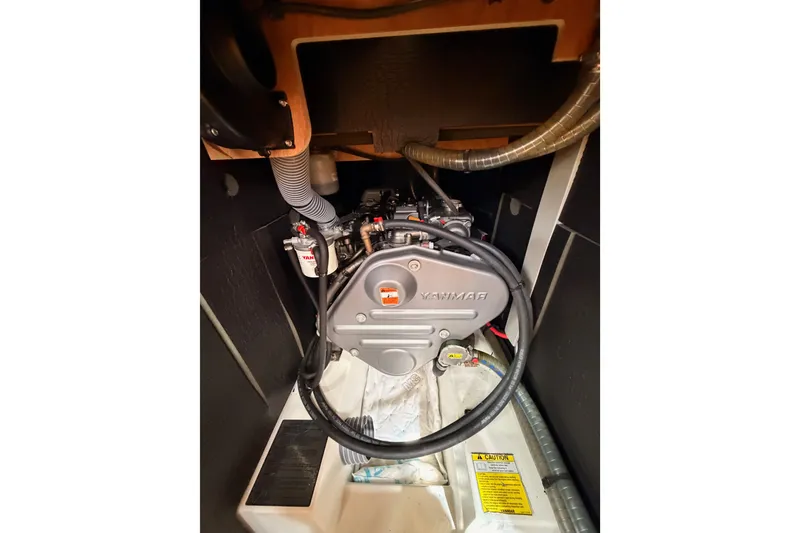 Slide: The Image of Engine compartment of a 2015 Jeanneau Sun Odyssey 469 sailboat, featuring a Yanmar engine. - 72