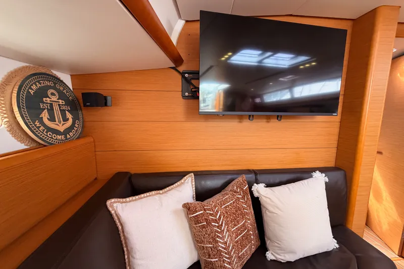 Slide: The Image of Interior of 2015 Jeanneau Sun Odyssey 469 yacht with TV and decorative pillows. - 56