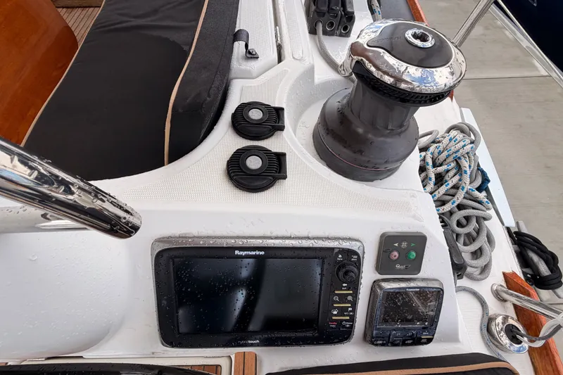 Slide: The Image of Cockpit of 2015 Jeanneau Sun Odyssey 469 with navigation equipment and winch. - 30