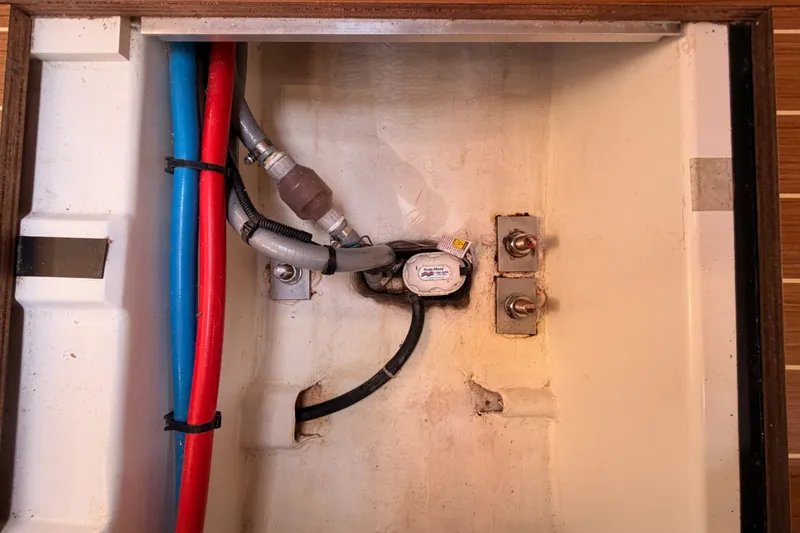 Slide: The Image of Electrical and plumbing components inside a 2015 Jeanneau Sun Odyssey 469 yacht. - 71