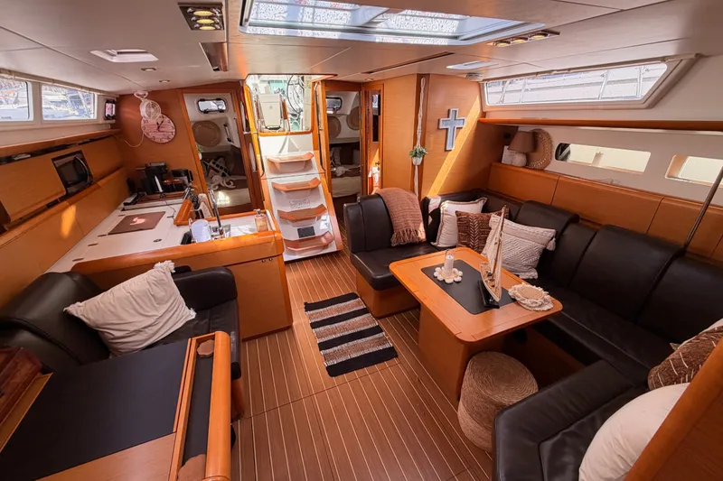 Slide: The Image of Interior of 2015 Jeanneau Sun Odyssey 469 yacht with cozy seating and modern amenities. - 70