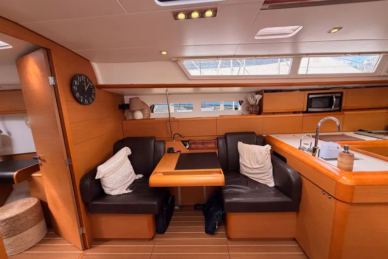 Slide: The Image of Interior of 2015 Jeanneau Sun Odyssey 469 yacht with cozy seating and modern kitchen. - 57