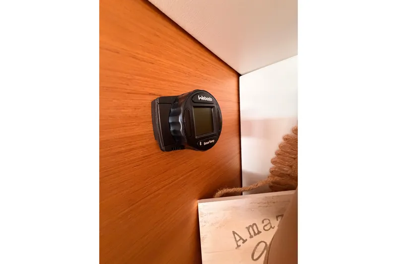 Slide: The Image of Thermostat on wooden panel inside 2015 Jeanneau Sun Odyssey 469 yacht cabin. - 54