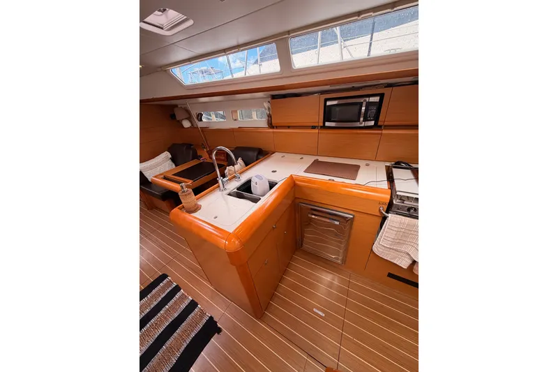 Slide: The Image of Interior of 2015 Jeanneau Sun Odyssey 469 yacht with modern kitchen amenities. - 41