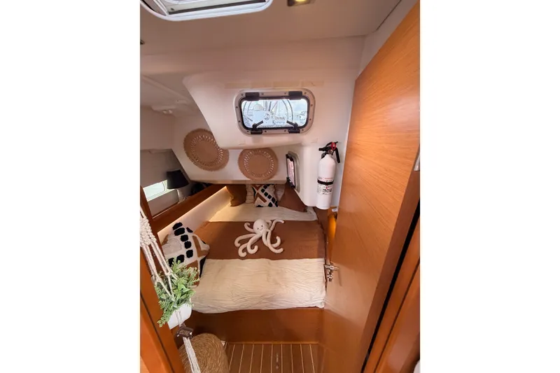 Slide: The Image of Cozy cabin interior of 2015 Jeanneau Sun Odyssey 469 sailboat with plush decor. - 43