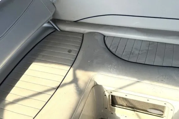 Slide: The Image of 2004 Bayliner 285 Cruiser interior with clean, spacious seating and flooring. - 6