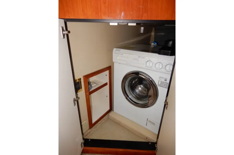 Slide: The Image of Washing machine inside a 2000 Sea Ray 380 Aft Cabin yacht compartment. - 55