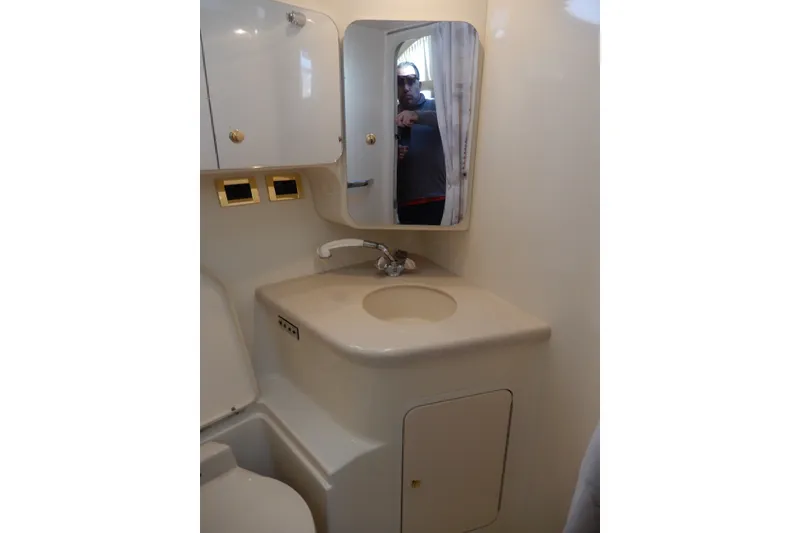 Slide: The Image of Bathroom interior of 2000 Sea Ray 380 Aft Cabin yacht with sink and mirror. - 56