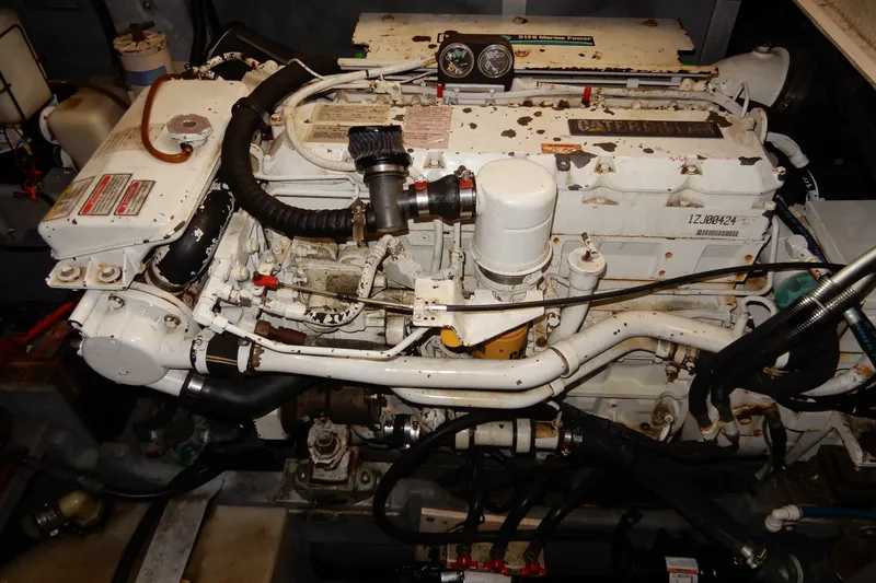 Slide: The Image of Engine of a 2000 Sea Ray 380 Aft Cabin boat, featuring Caterpillar components. - 82