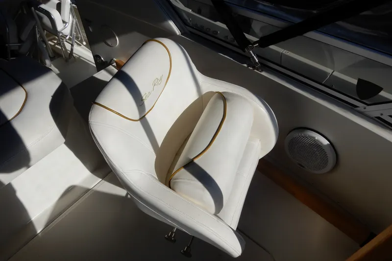 Slide: The Image of White leather seat on 2000 Sea Ray 380 Aft Cabin boat, featuring elegant design and stitching. - 23