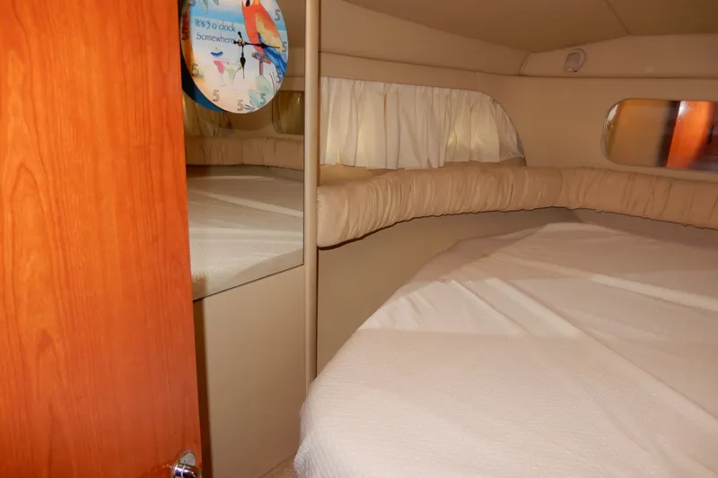 Slide: The Image of Interior cabin of 2000 Sea Ray 380 Aft Cabin yacht with bed and decorative clock. - 61