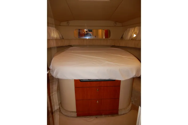 Slide: The Image of Interior cabin of 2000 Sea Ray 380 Aft Cabin yacht with bed and wooden drawers. - 59