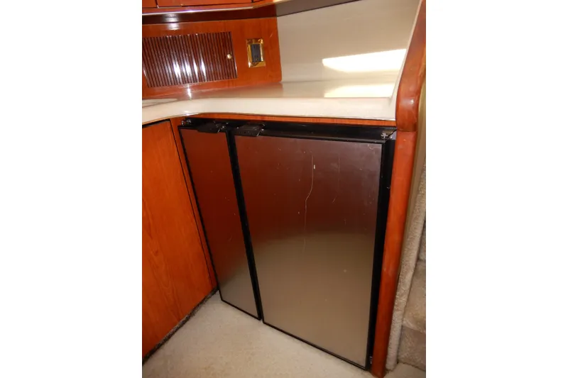 Slide: The Image of Stainless steel refrigerator in 2000 Sea Ray 380 Aft Cabin yacht interior. - 49