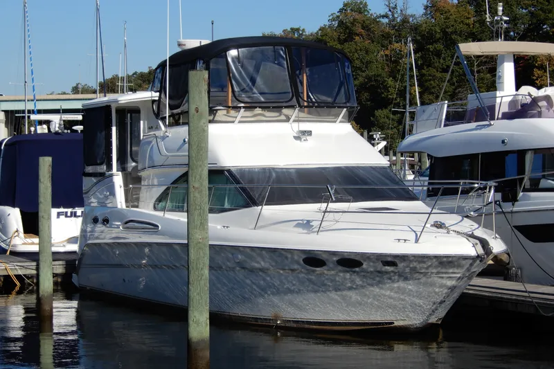 The Image of 2000 Sea Ray 380 Aft Cabin yacht docked at marina, featuring sleek design and spacious cabin. - 0