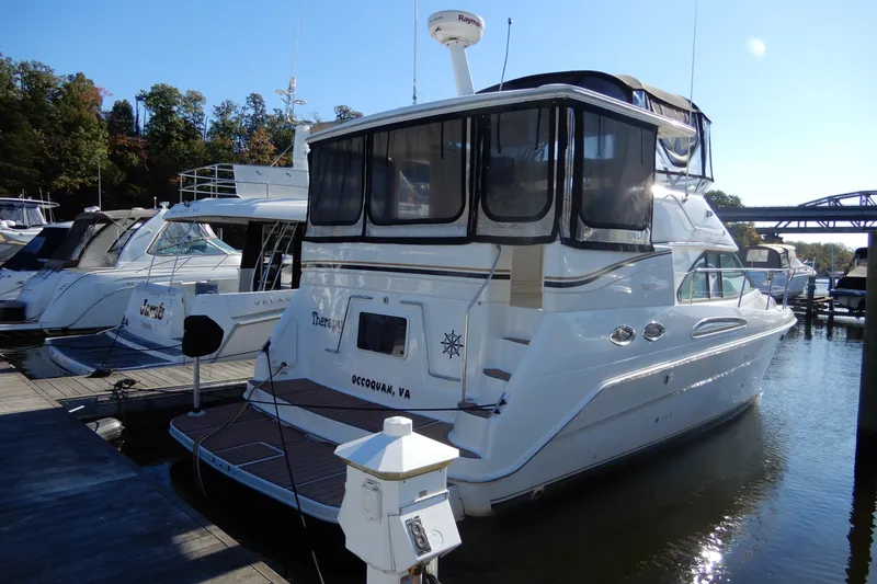 Slide: The Image of 2000 Sea Ray 380 Aft Cabin yacht docked at marina, rear view. - 3