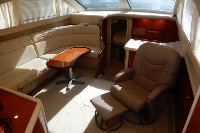 Slide: The Image of Luxurious interior of 2000 Sea Ray 380 Aft Cabin yacht with plush seating and table. - 40