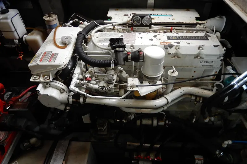 Slide: The Image of Engine of a 2000 Sea Ray 380 Aft Cabin boat, featuring Caterpillar components. - 81