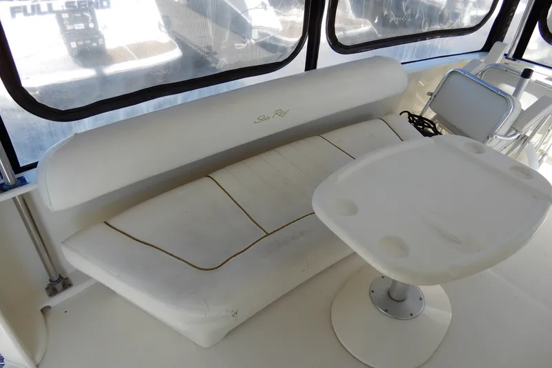 Slide: The Image of Interior of 2000 Sea Ray 380 Aft Cabin with white seating and table. - 13