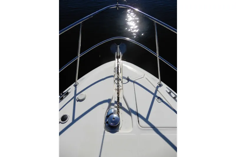Slide: The Image of Bow view of 2000 Sea Ray 380 Aft Cabin yacht with sunlight reflecting on water. - 35
