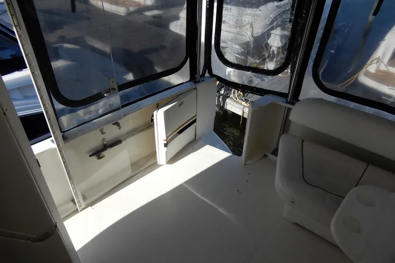 Slide: The Image of Interior view of 2000 Sea Ray 380 Aft Cabin yacht with seating and windows. - 14