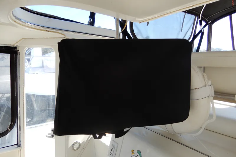 Slide: The Image of Interior view of a 2000 Sea Ray 380 Aft Cabin with covered equipment. - 18