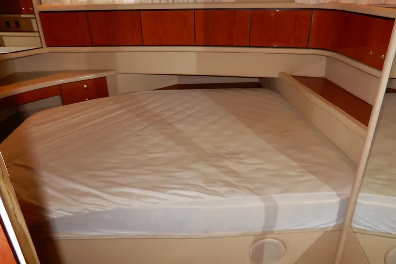 Slide: The Image of Interior cabin of 2000 Sea Ray 380 Aft Cabin yacht with bed and wooden cabinets. - 67