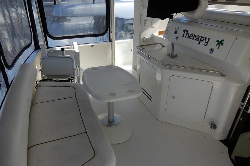 Slide: The Image of Interior of a 2000 Sea Ray 380 Aft Cabin yacht with seating and kitchenette. - 9