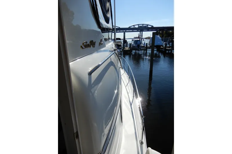 Slide: The Image of 2000 Sea Ray 380 Aft Cabin yacht docked at marina, side view. - 32