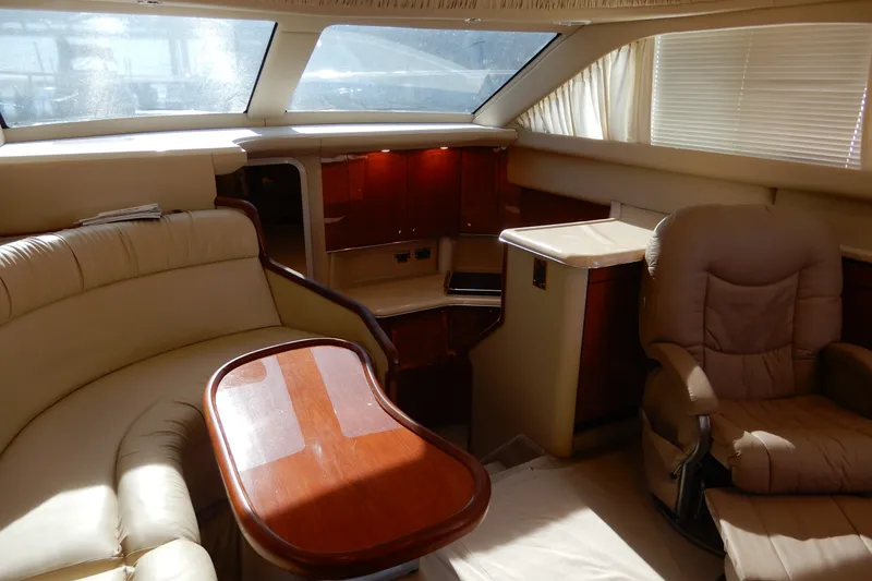 Slide: The Image of Luxurious interior of a 2000 Sea Ray 380 Aft Cabin yacht with plush seating. - 43